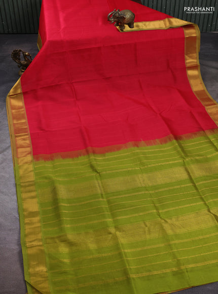 Silk cotton saree tomato pink and light green with plain body and zari woven border