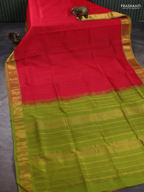 Silk cotton saree tomato pink and light green with plain body and zari woven border