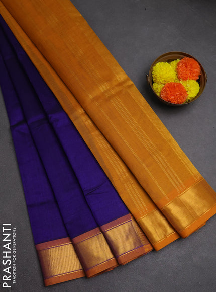 Silk cotton saree blue and mustard yellow with plain body and zari woven border