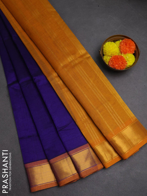 Silk cotton saree blue and mustard yellow with plain body and zari woven border