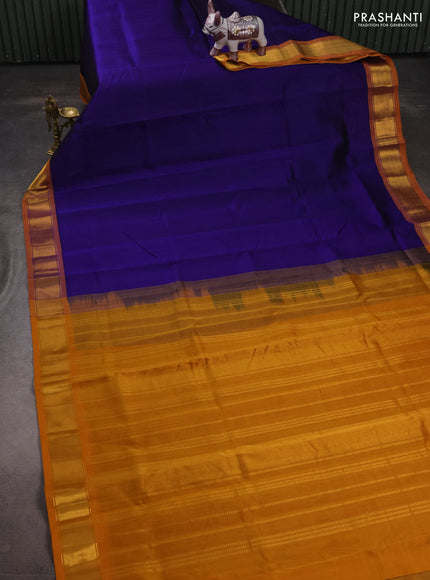 Silk cotton saree blue and mustard yellow with plain body and zari woven border