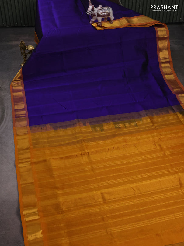 Silk cotton saree blue and mustard yellow with plain body and zari woven border