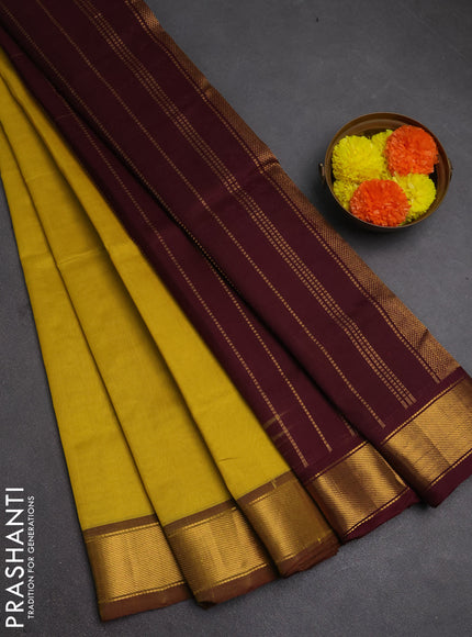 Silk cotton saree lime yellow and wine shade with plain body and zari woven border