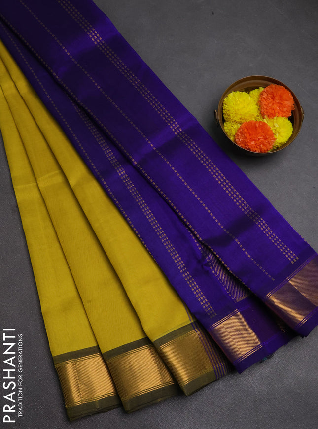 Silk cotton saree lime yellow and blue with plain body and zari woven border