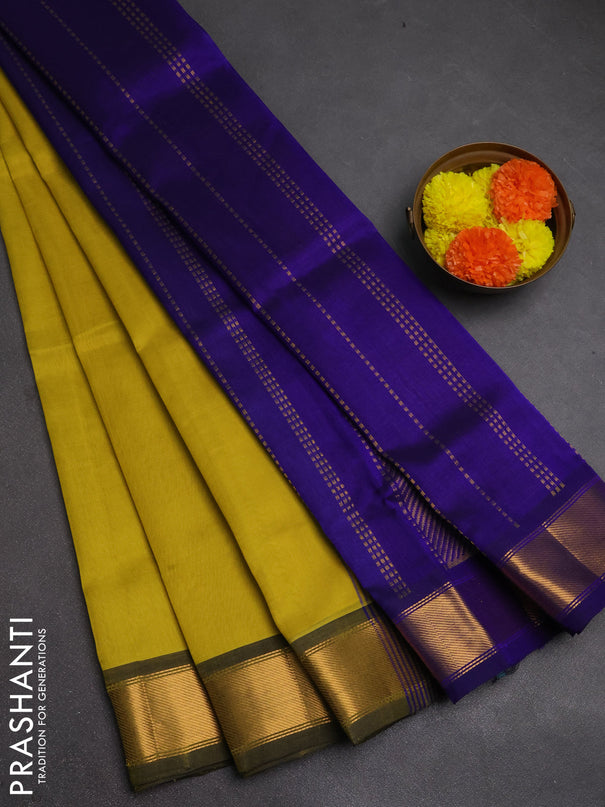 Silk cotton saree lime yellow and blue with plain body and zari woven border