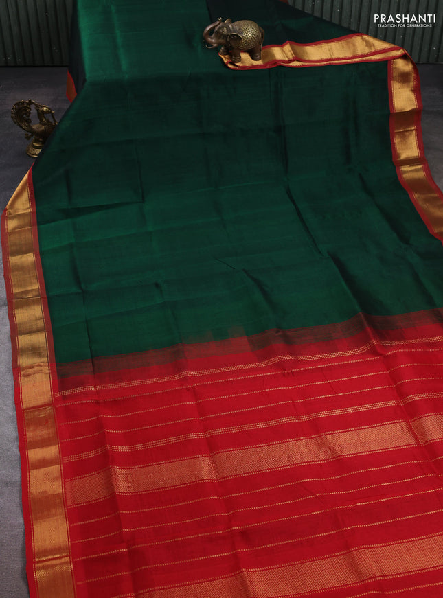 Silk cotton saree green and red with plain body and zari woven border
