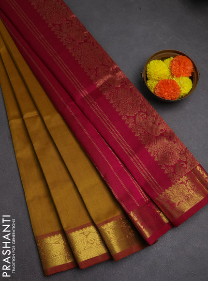 Silk cotton saree dark mustard and dark magenta pink with plain body and elephant & annam zari woven border