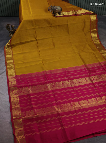 Silk cotton saree dark mustard and dark magenta pink with plain body and elephant & annam zari woven border