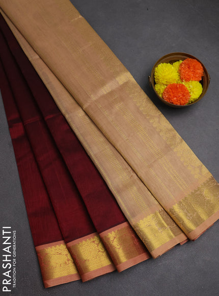 Silk cotton saree maroon and pastel peach shade with plain body and zari woven border
