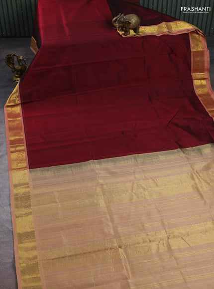 Silk cotton saree maroon and pastel peach shade with plain body and zari woven border