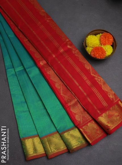 Silk cotton saree dual shade of teal green and red with plain body and zari woven border