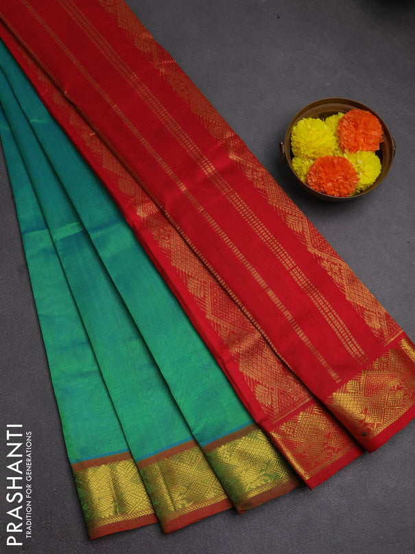 Silk cotton saree dual shade of teal green and red with plain body and zari woven border