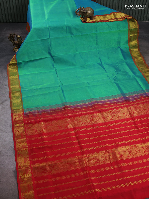 Silk cotton saree dual shade of teal green and red with plain body and zari woven border