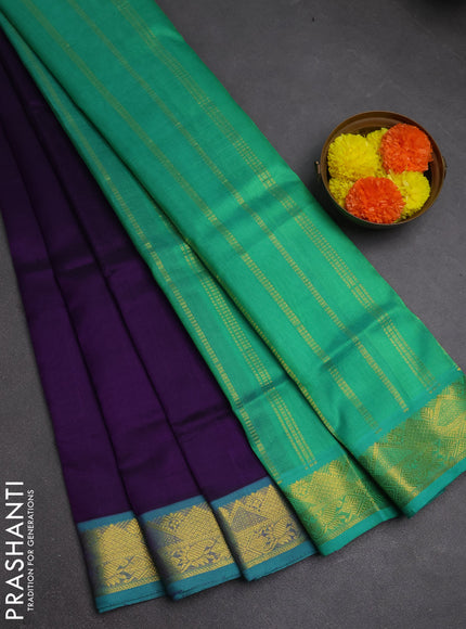 Silk cotton saree violet and teal green with plain body and zari woven border