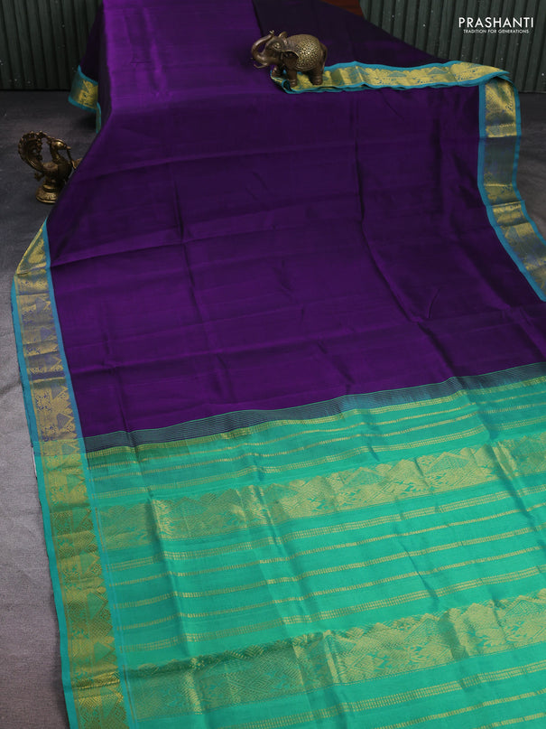 Silk cotton saree violet and teal green with plain body and zari woven border