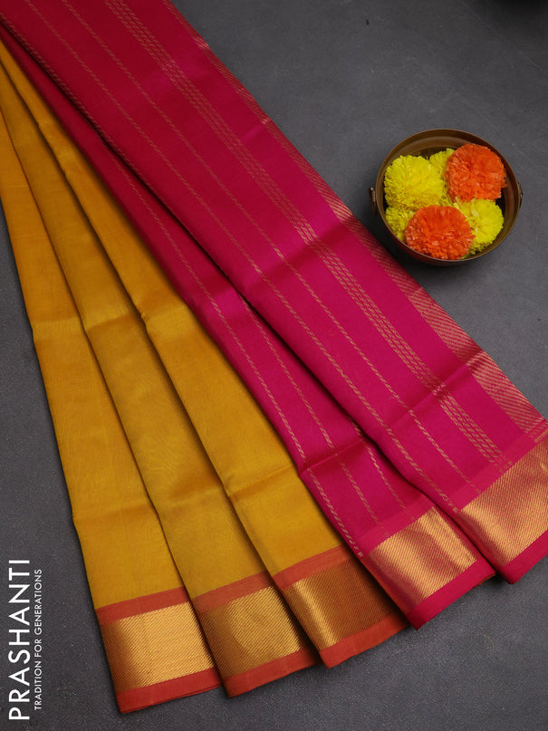 Silk cotton saree mustard yellow and pink with plain body and zari woven border