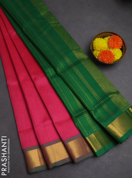 Silk cotton saree pink and green with plain body and zari woven border
