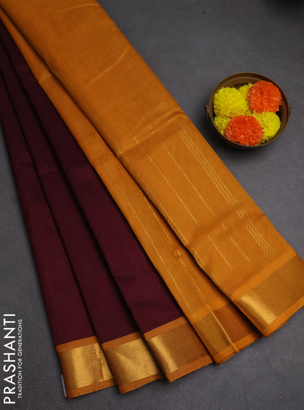 Silk cotton saree maroon and mustard yellow with plain body and zari woven border