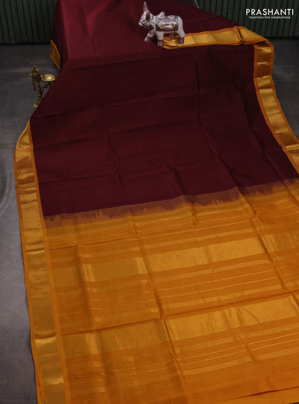Silk cotton saree maroon and mustard yellow with plain body and zari woven border
