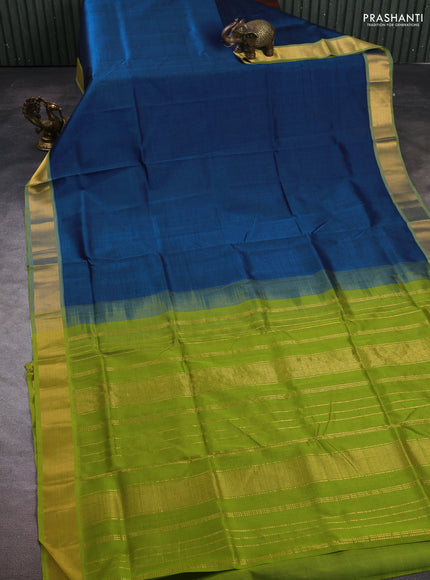 Silk cotton saree peacock blue and light green with plain body and zari woven border