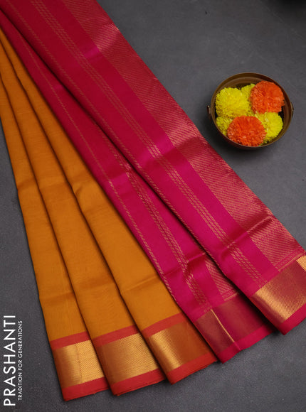 Silk cotton saree mustard yellow and pink with plain body and zari woven border