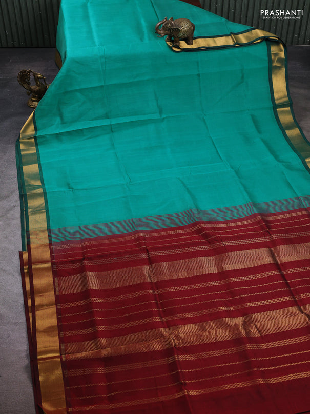 Silk cotton saree teal green and maroon with plain body and zari woven border