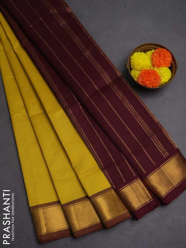 Silk cotton saree lime yellow and wine shade with plain body and zari woven border