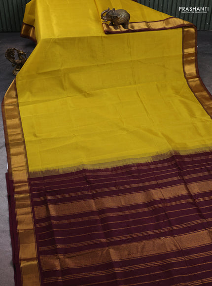 Silk cotton saree lime yellow and wine shade with plain body and zari woven border