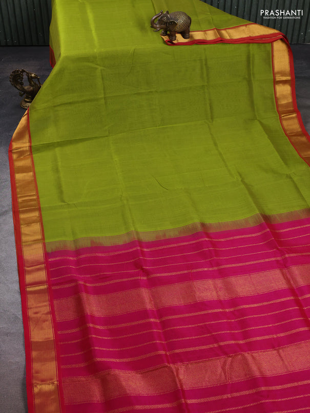 Silk cotton saree light green and pink with plain body and zari woven border