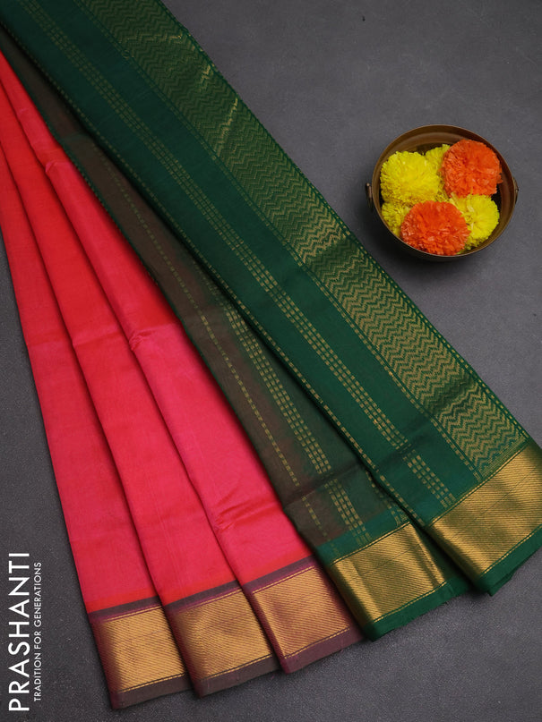 Silk cotton saree candy pink and green with plain body and zari woven border