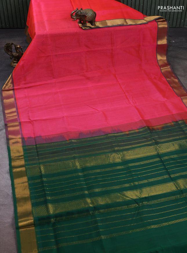 Silk cotton saree candy pink and green with plain body and zari woven border