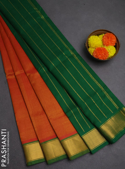 Silk cotton saree sunset orange and green with plain body and zari woven border