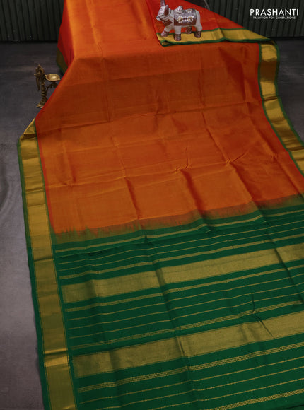 Silk cotton saree sunset orange and green with plain body and zari woven border