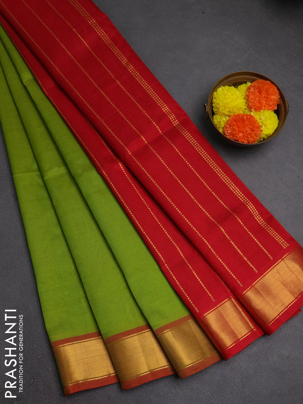 Silk cotton saree light green and red with plain body and zari woven border
