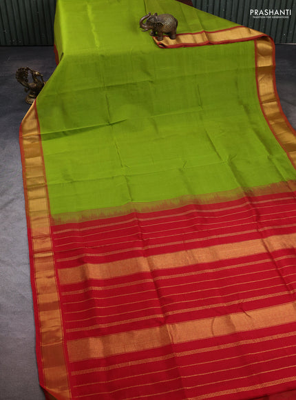 Silk cotton saree light green and red with plain body and zari woven border