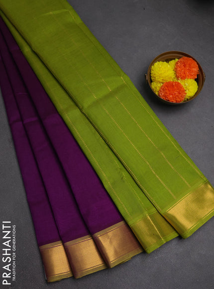 Silk cotton saree purple and light green with plain body and zari woven border
