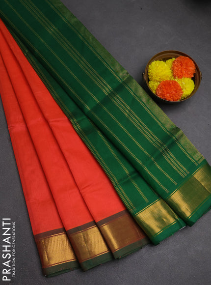 Silk cotton saree peach orange and green with plain body and zari woven border