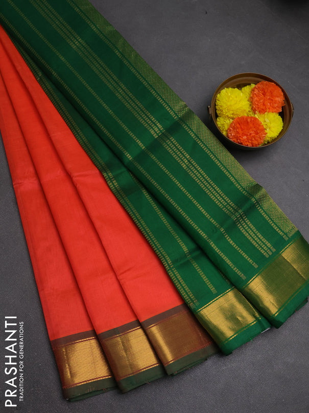 Silk cotton saree peach orange and green with plain body and zari woven border