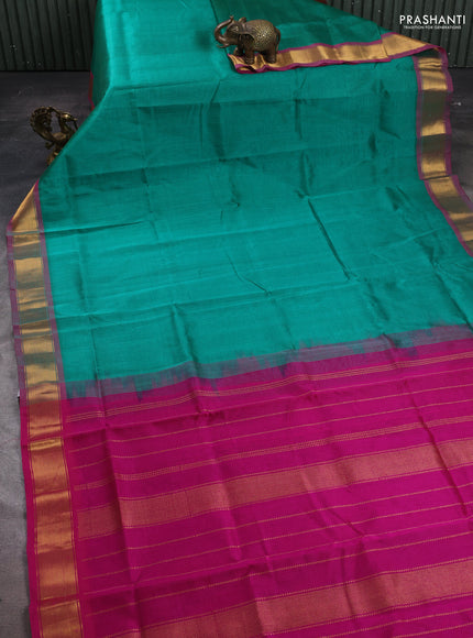 Silk cotton saree green and magenta pink with plain body and zari woven border