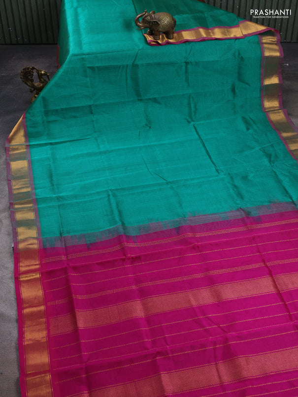 Silk cotton saree green and magenta pink with plain body and zari woven border