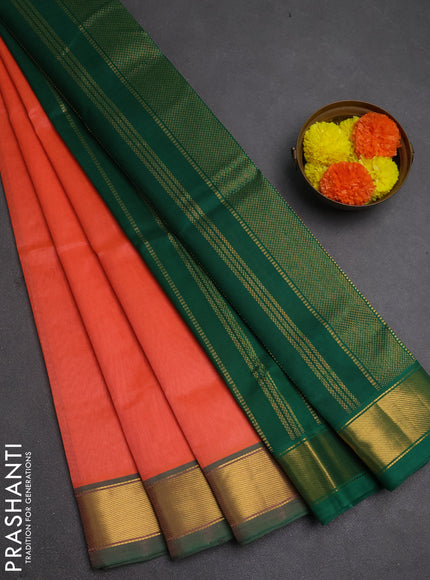 Silk cotton saree peach orange and green with plain body and zari woven border
