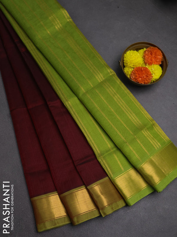 Silk cotton saree maroon and green with plain body and zari woven border