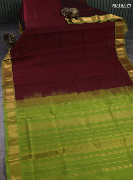 Silk cotton saree maroon and green with plain body and zari woven border
