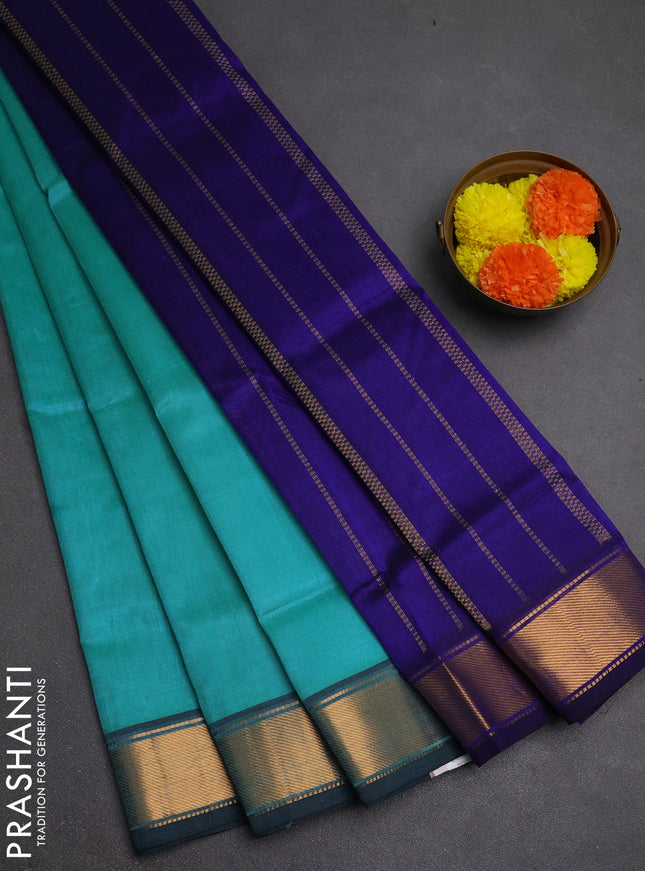 Silk cotton saree teal blue and blue with plain body and zari woven border