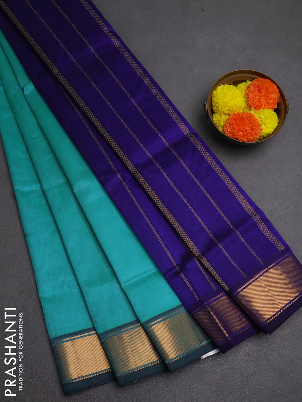 Silk cotton saree teal blue and blue with plain body and zari woven border