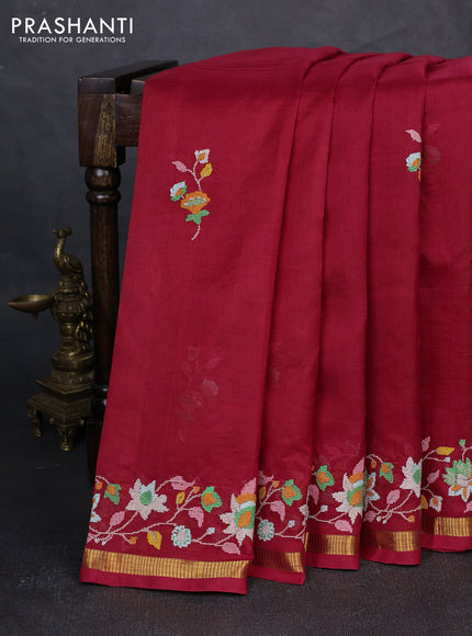 Silk cotton saree maroon with floral convent embroidery buttas and zari woven border