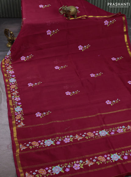 Silk cotton saree maroon with floral convent embroidery buttas and zari woven border