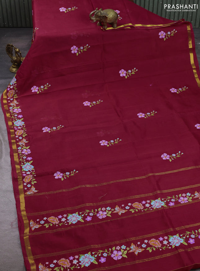 Silk cotton saree maroon with floral convent embroidery buttas and zari woven border