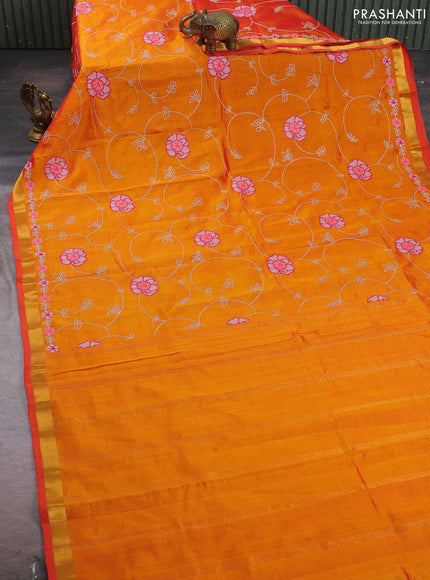 Silk cotton saree sunset orange with allover convent embroidery weaves and zari woven border