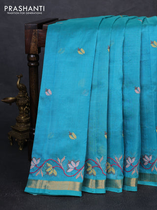 Silk cotton saree teal blue with floral convent embroidery buttas and zari woven border